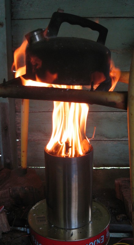 Boiling a kettle over a fire of sticks and bamboo.