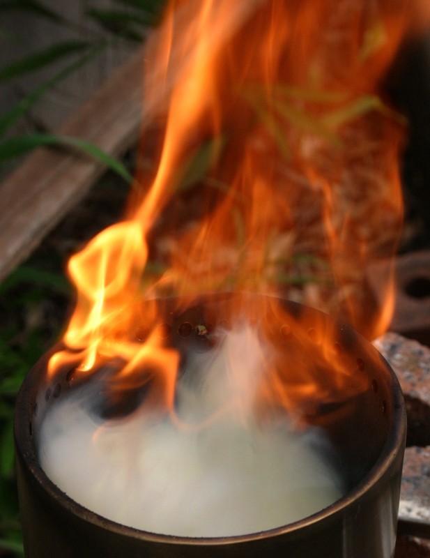 The smoke from gasified chicken feed burning with a clean flame.